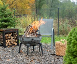 Fire pit and burning fire in a garden